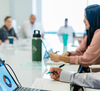 Energy executives working in a board room.
